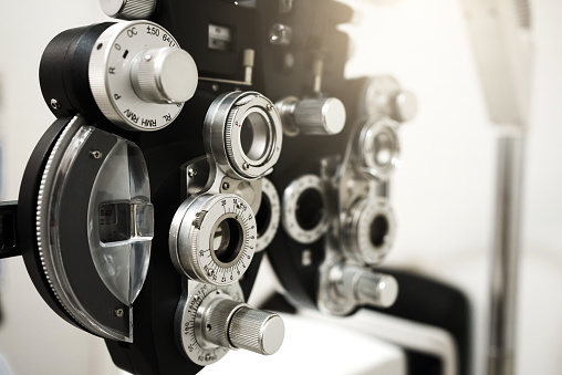 Close up of phoropter eyesight measurement testing machine, Eye health check and ophthalmology concept.