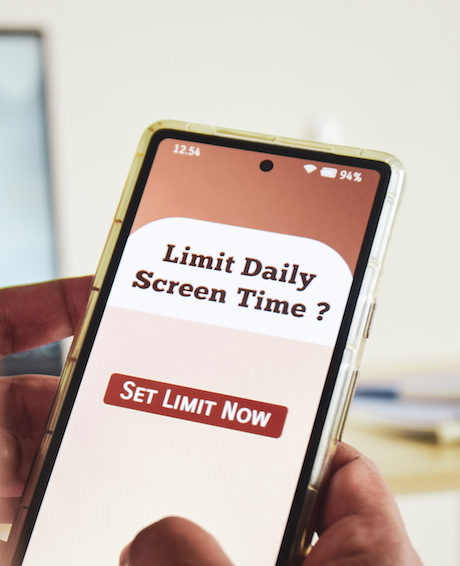 Person is trying to set screen time limit usage on his smartphone. Digital wellbeing concept.